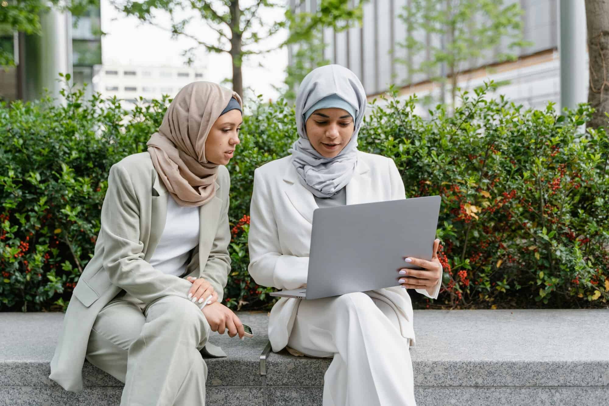 two women entrepreneurs looking at a laptop