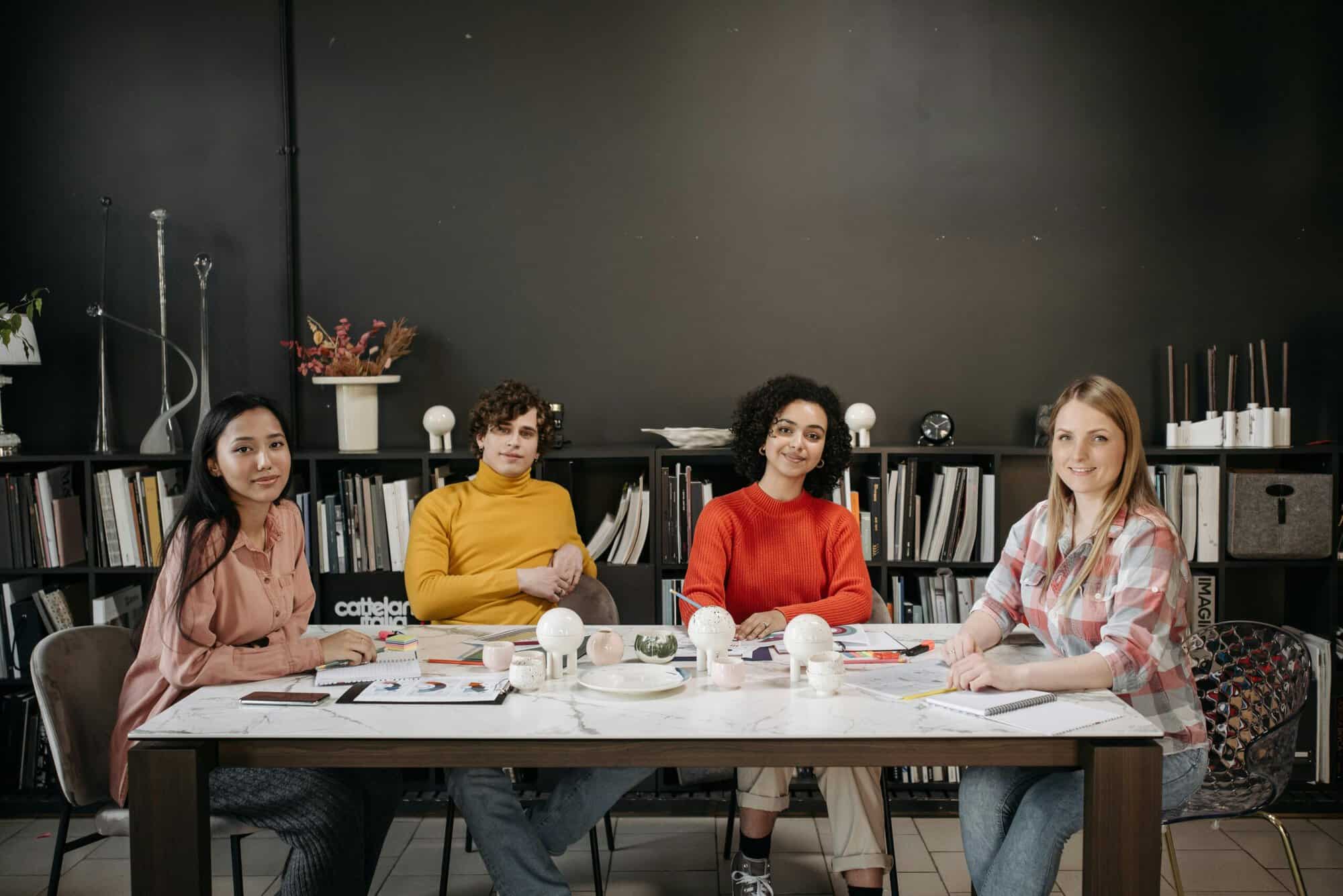 Artists sitting around a table learning about Business Registration