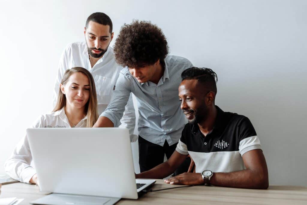 group of job seekers looking at computer to gain new skills